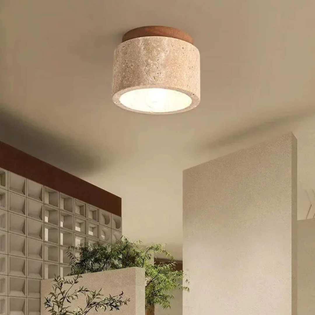 Fitlybuy Radia minimalist ceiling light: cylindrical stone texture shade with wood top, emitting a warm, cozy glow.