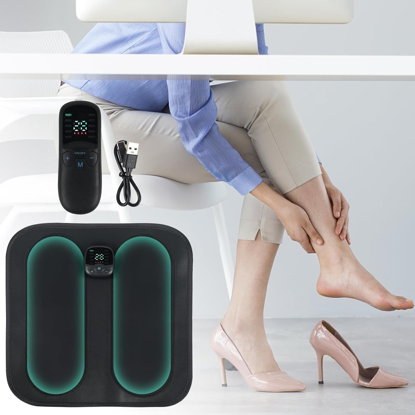 Fitlybuy black EMS foot massager pad with remote control, USB cable, and a woman using it under an office desk.