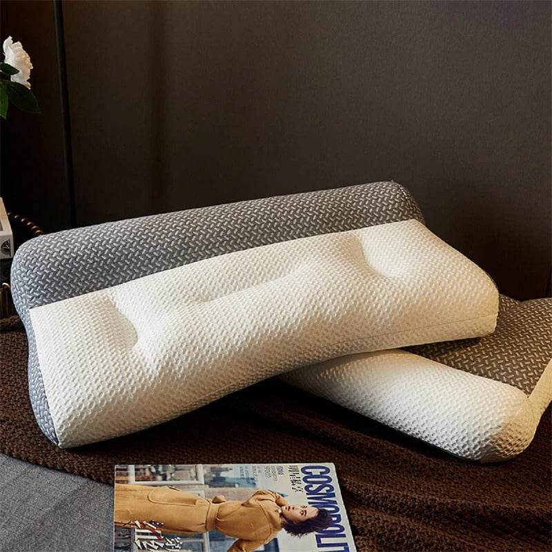 Fitlybuy ergonomic two-tone white and grey textured foam pain relief pillows on a brown textured surface with magazine.
