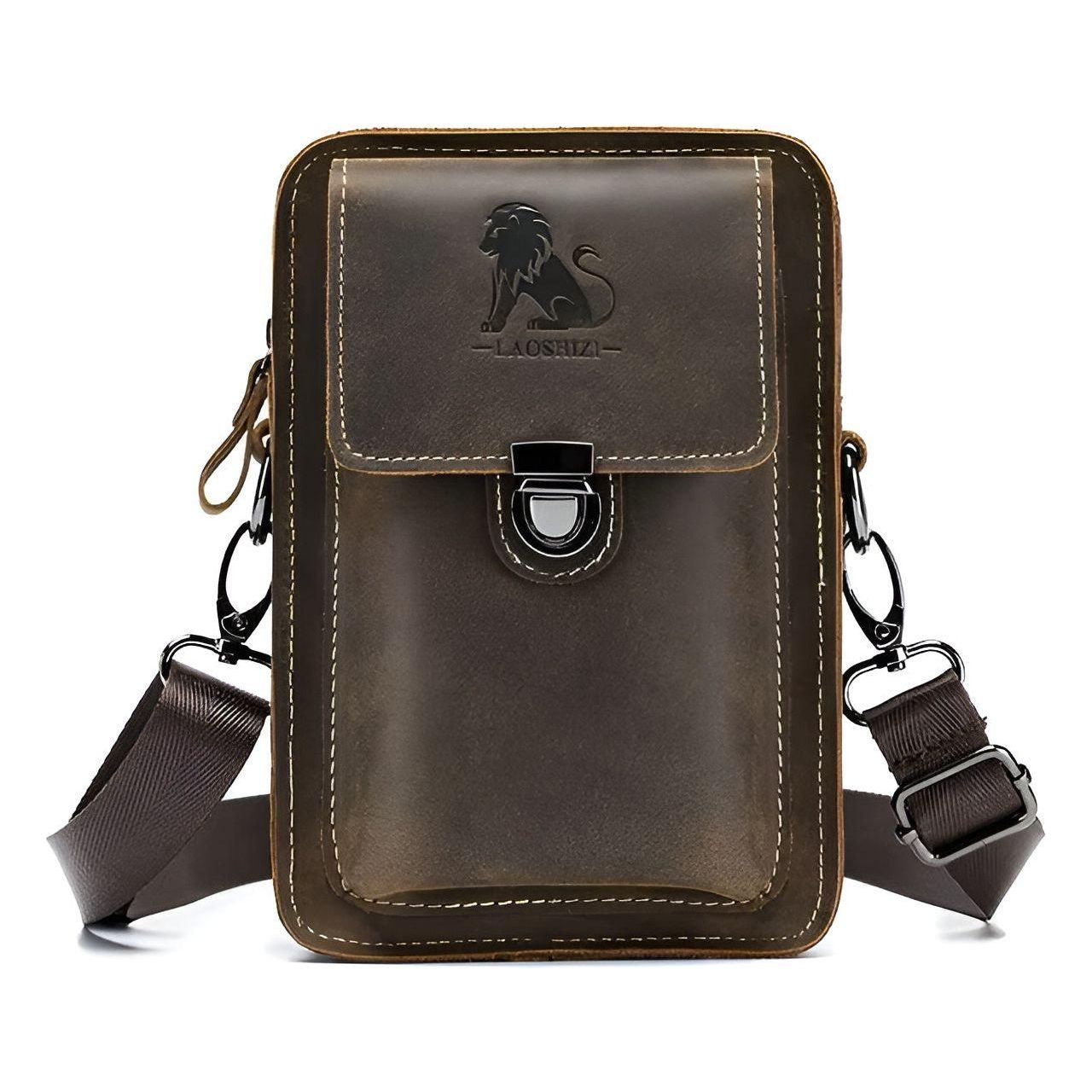 Brown leather Fitlybuy Vidal waist bag with lion logo, flap closure, and adjustable shoulder strap on white background.