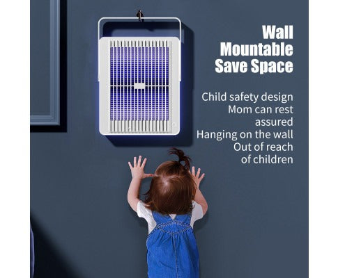 White wall-mounted Fitlybuy electric insect killer with purple light, hanging safely above a young child.