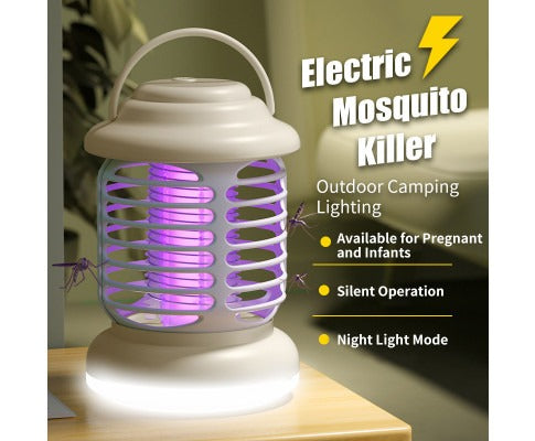 Fitlybuy white, portable mosquito bug zapper lantern with a glowing purple electric grid, sitting on a wooden surface.