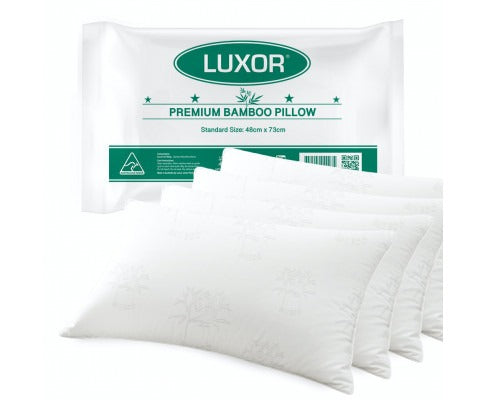 Luxor premium white bamboo cooling pillows with subtle patterns, displayed with packaging. Standard 48x73cm size.