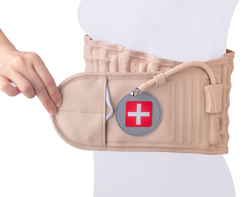Beige Fitlybuy decompression back belt with lumbar support, air valve, and red medical cross patch worn on waist.