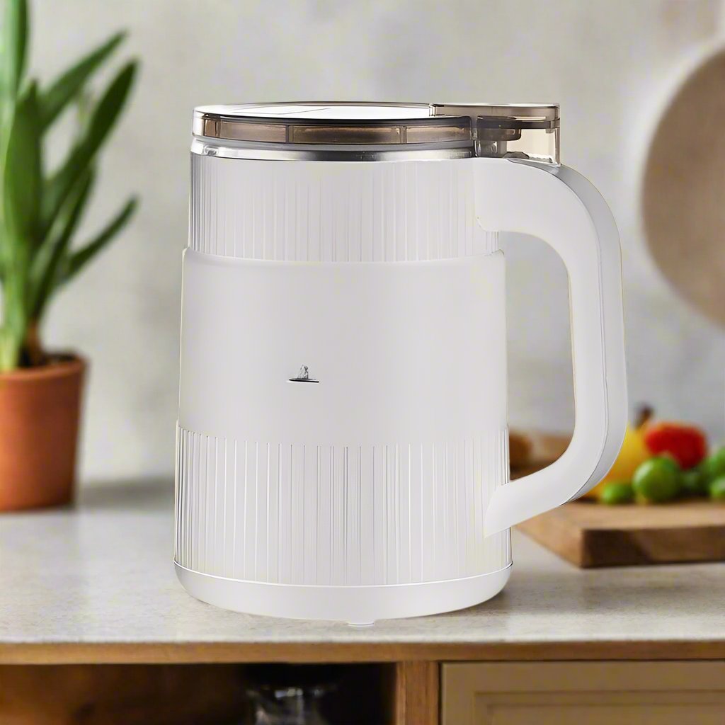 Fitlybuy white electric grain mill with a clear lid and textured base, sitting on a kitchen counter.