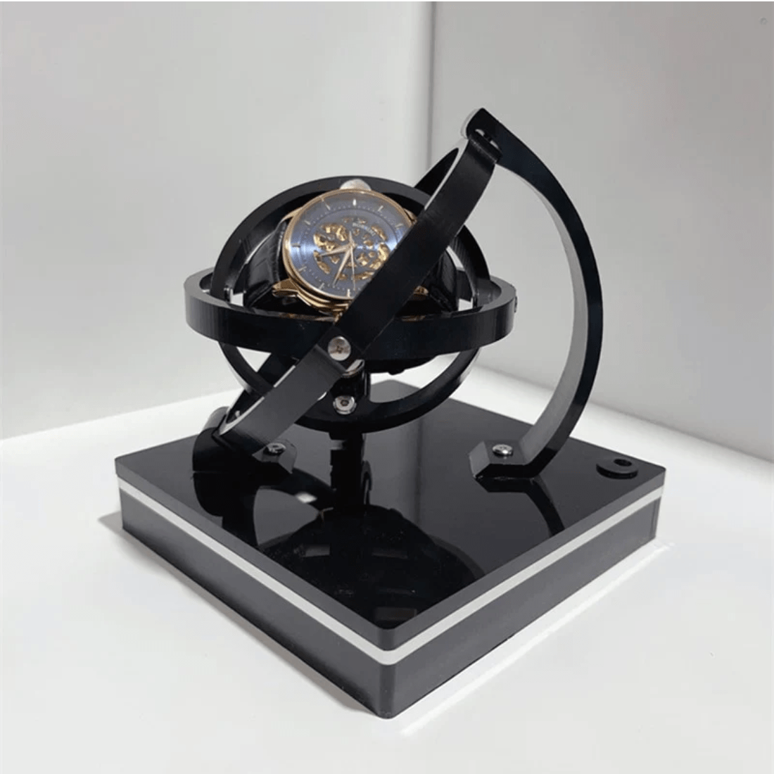 Fitlybuy black luxury automatic watch winder with a gyroscope design, featuring a skeleton watch on a glossy base.