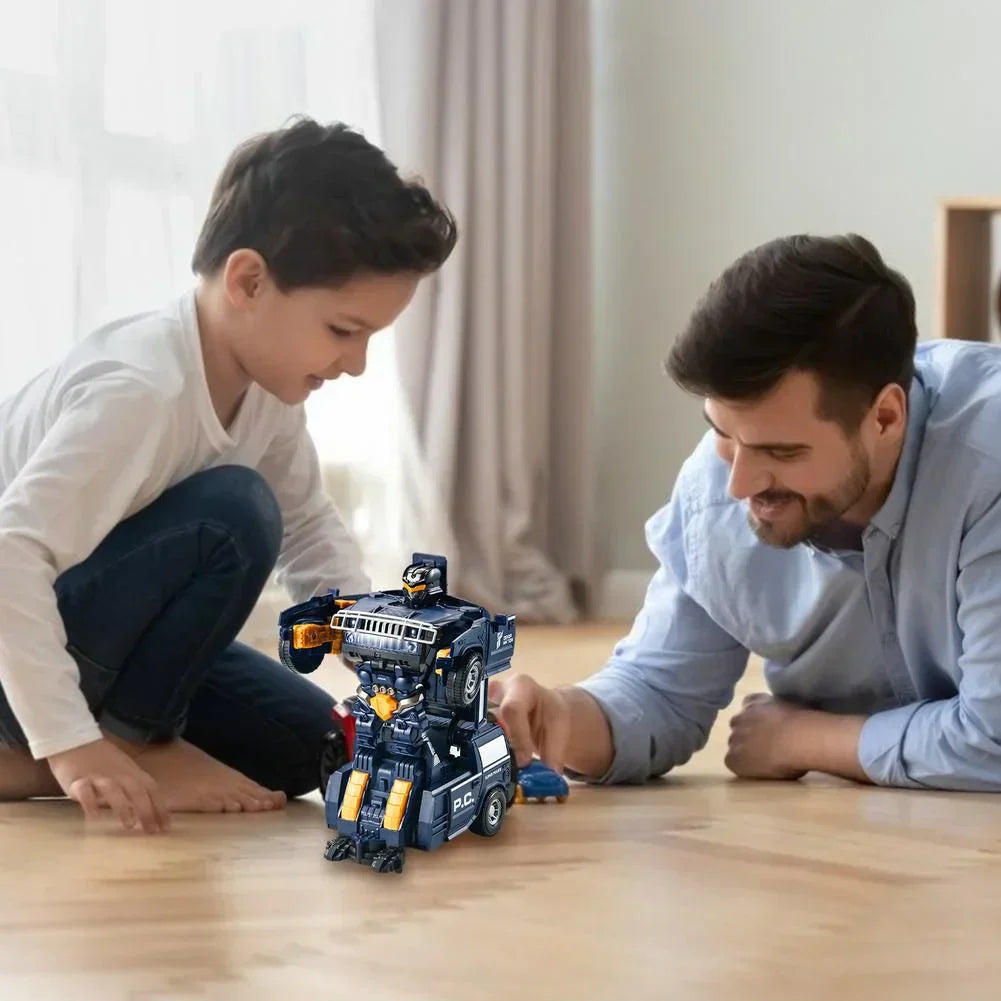 Father and son play with a dark blue and yellow transforming police car robot toy on a wooden floor.