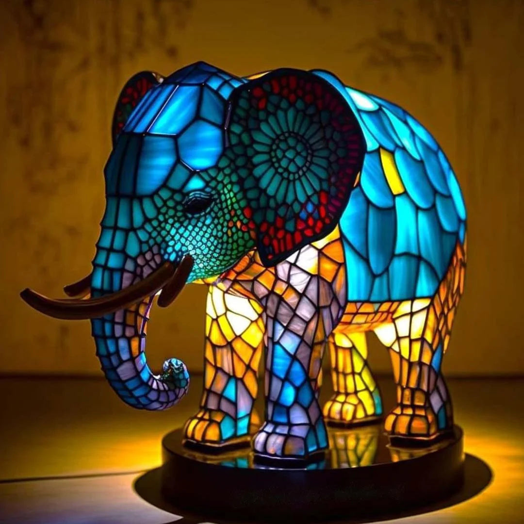 Fitlybuy elephant-shaped lamp with multicolored, stained-glass inspired mosaic design and warm ambient glow.