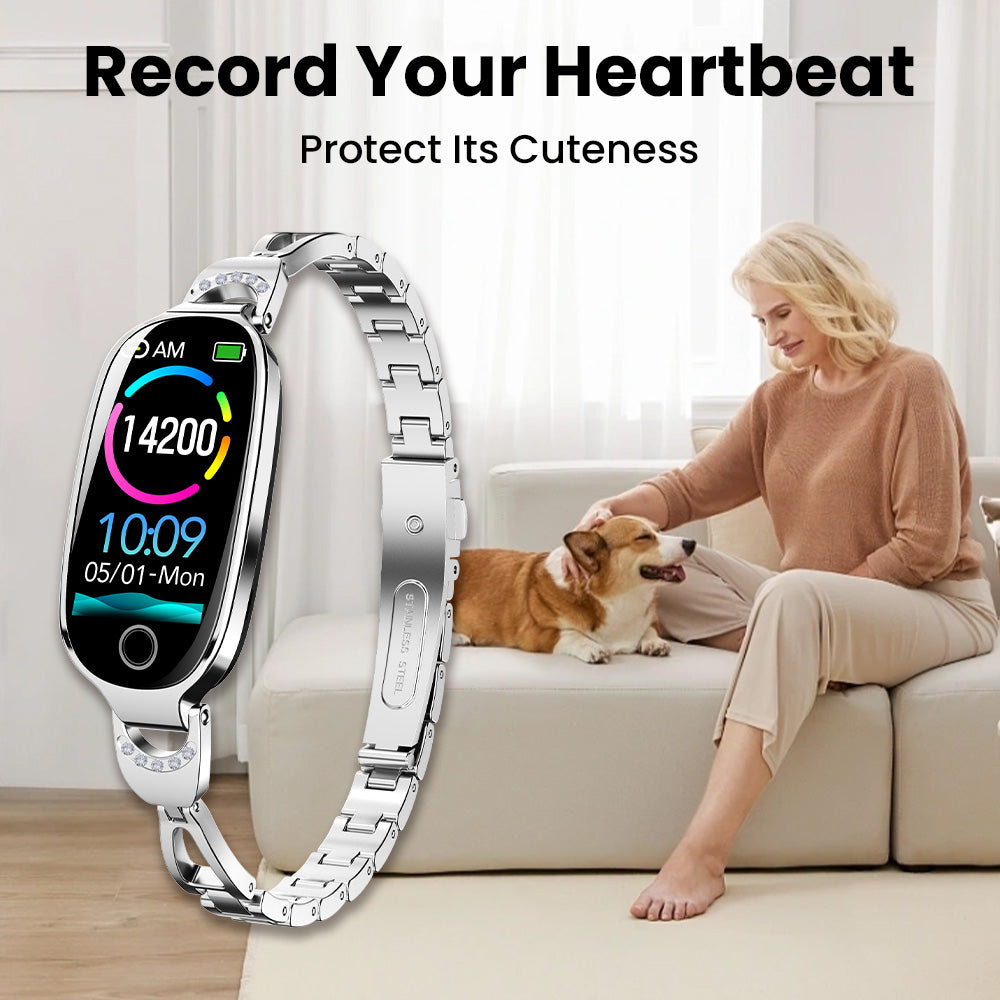 Fitlybuy Kexi-Life diamond-accented stainless steel health smartwatch showing a woman petting a dog in the background.