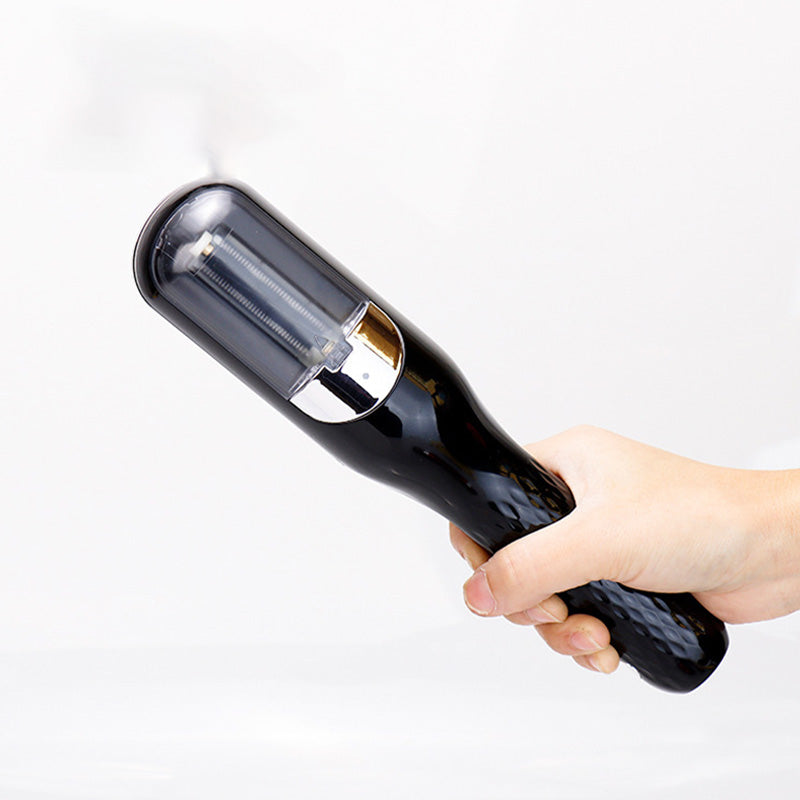 A hand holding a sleek black Fitlybuy automatic split-end hair trimmer with a clear cap and precision trim technology.