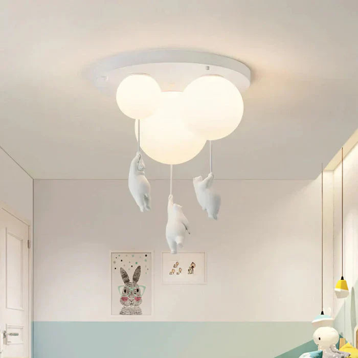 White Fitlybuy CloudBear LED ceiling light featuring three frosted balloon globes with hanging bear figures in a nursery.