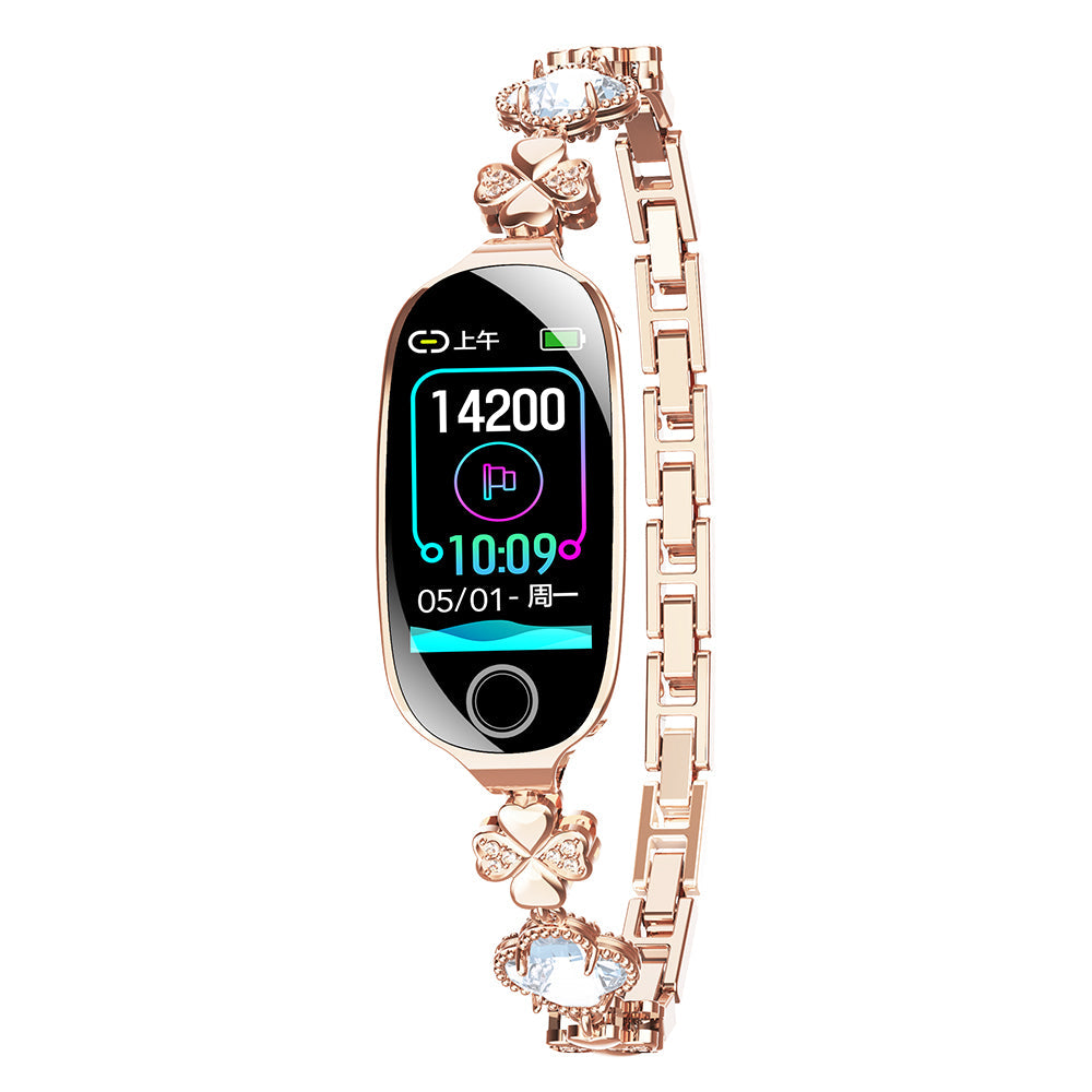 Rose gold luxury smartwatch with diamond-style accents and digital health display on an ornate link bracelet.