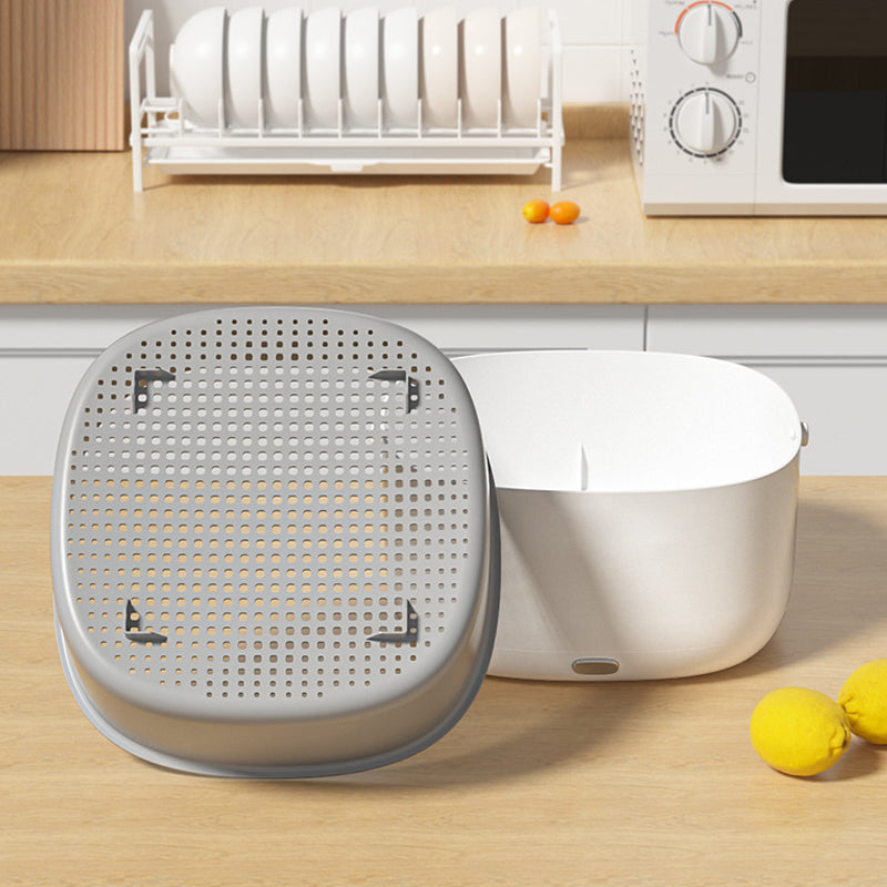 Fitlybuy FreshWave white ultrasonic cleaner with grey strainer basket, shown on a kitchen counter near lemons.
