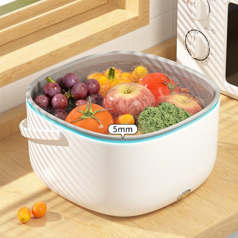 Fitlybuy FreshWave white ultrasonic cleaner filled with water, fruits, and vegetables on a kitchen counter.