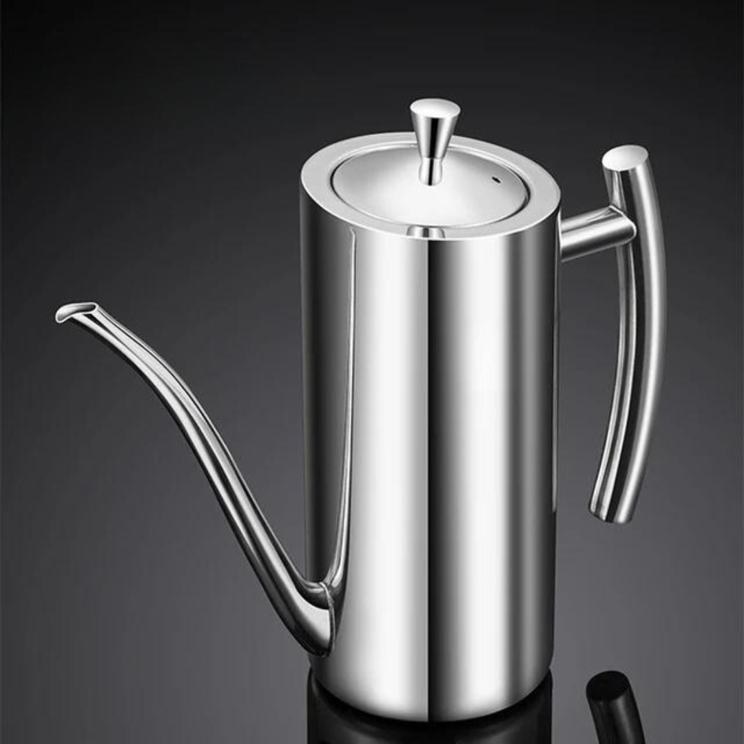 Polished stainless steel oil dispenser with a long, thin spout and ergonomic handle, set against a dark background.
