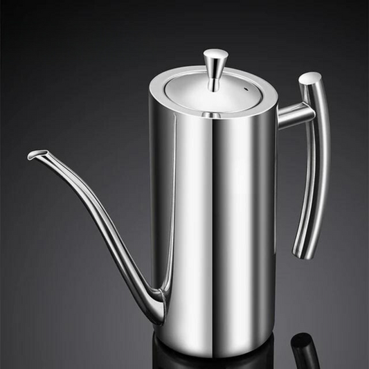 Polished stainless steel oil dispenser with a long, thin spout and ergonomic handle, set against a dark background.