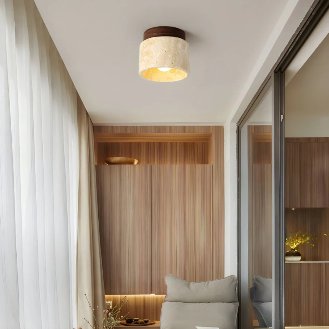 Fitlybuy Radia minimalist ceiling light with a warm glow, stone-textured shade, and wooden mount in a modern room.