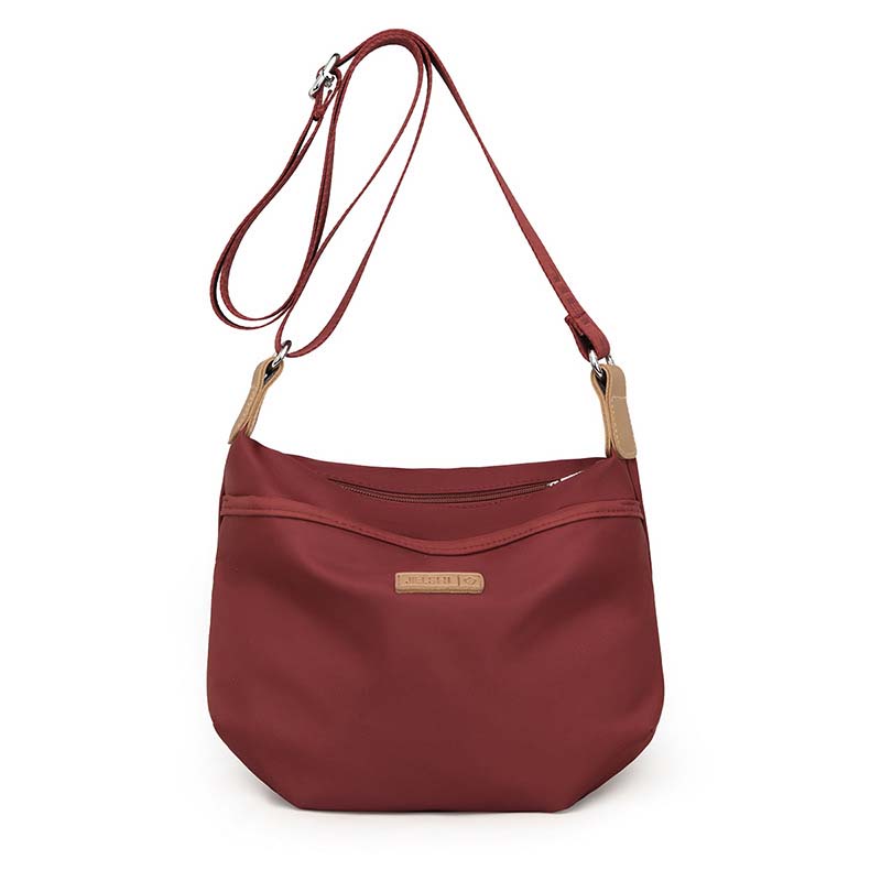 Red Fitlybuy Joanna waterproof anti-theft crossbody bag with adjustable strap and tan accents on white background.