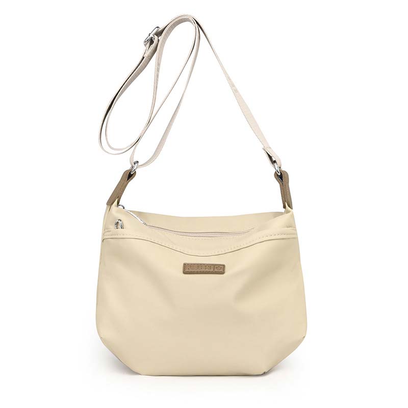 Beige waterproof crossbody shoulder bag with secure zipper, adjustable strap, and small brown logo patch.