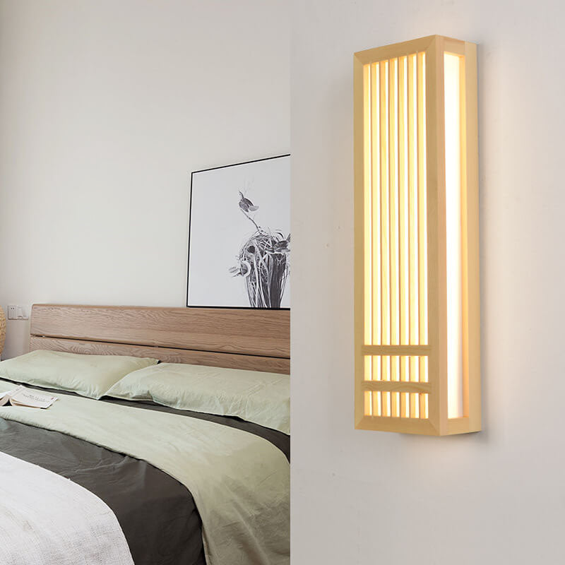 Fitlybuy ShizuLight vertical wooden LED wall lamp with warm ZenGlow lighting mounted on a modern bedroom wall.