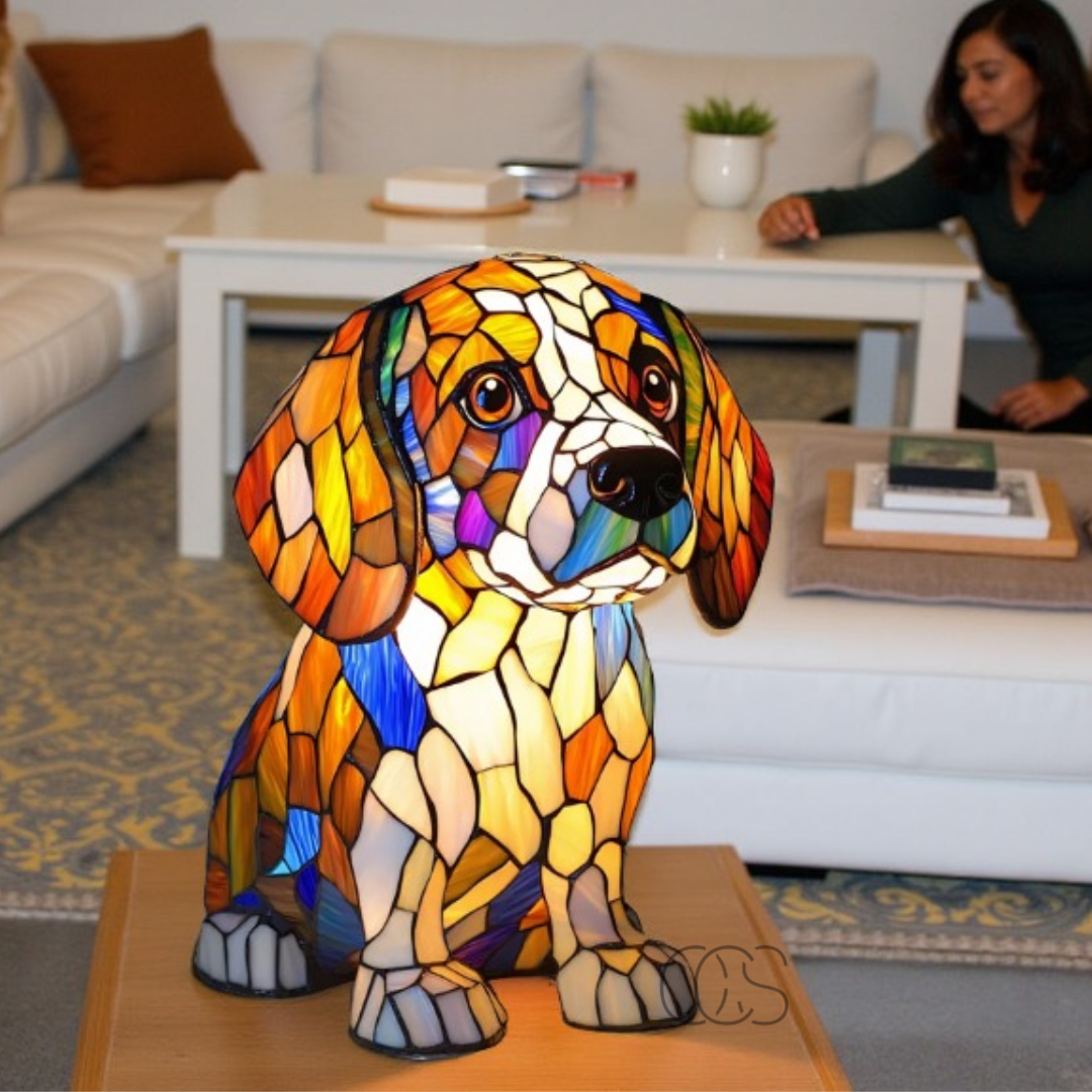 Fitlybuy GlowPaw stained-glass style dog lamp in orange, yellow, and blue, sitting on a table in a bright living room.