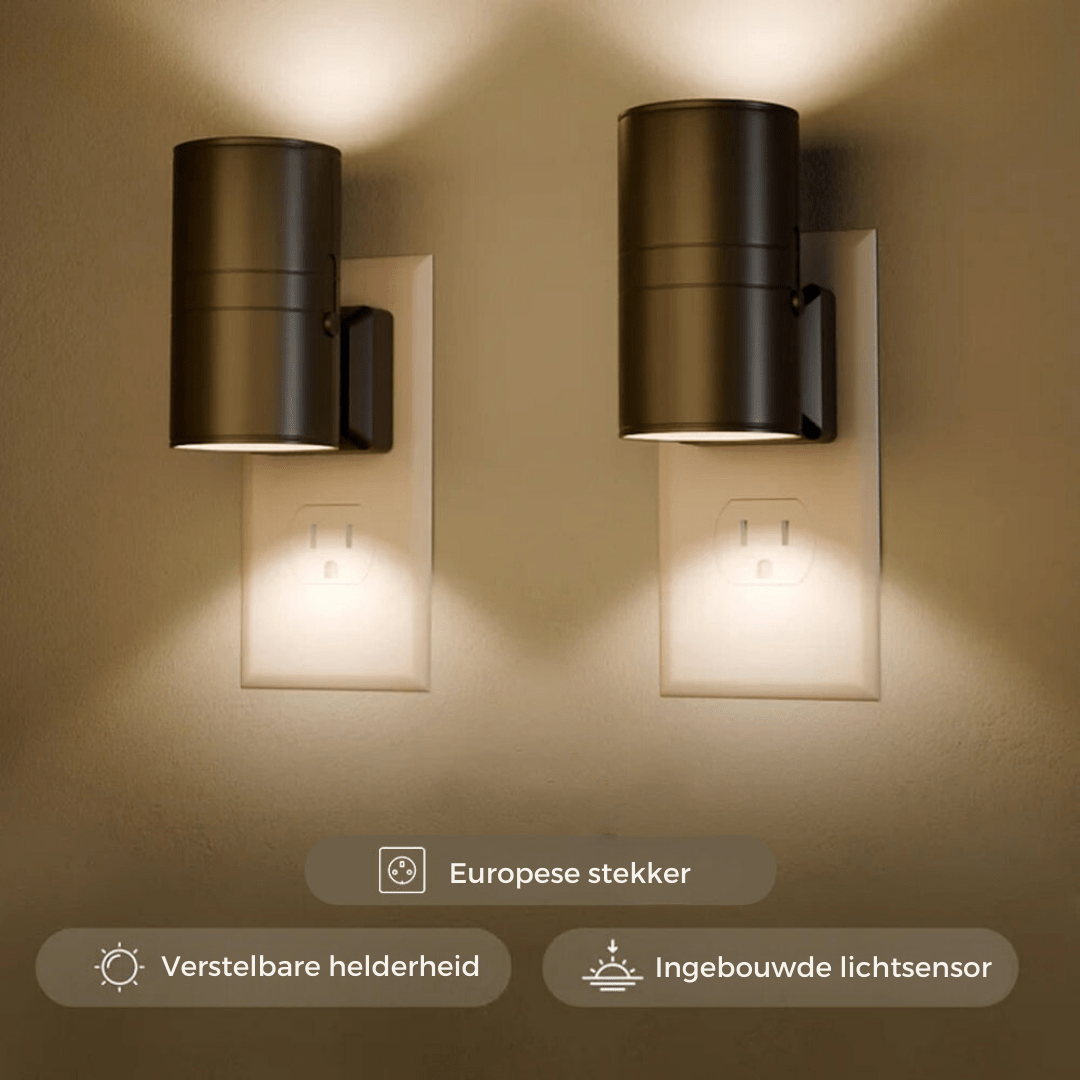 Two black cylindrical Fitlybuy Alova LED plug-in wall lights with warm, dimmable sensor illumination on a wall.