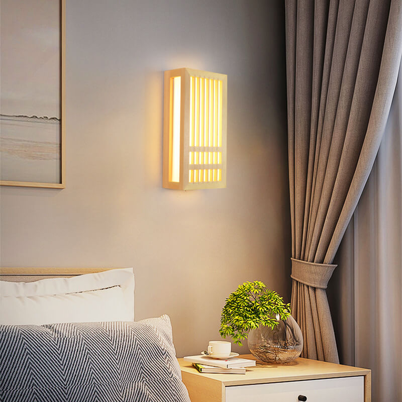 Fitlybuy ShizuLight wooden wall lamp with ZenGlow LED lighting, mounted in a cozy modern bedroom with a nightstand.