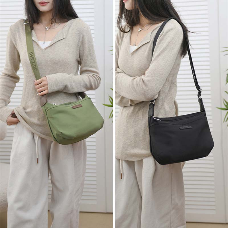 Woman modeling Fitlybuy Joanna anti-theft waterproof crossbody bags in olive green and black with adjustable straps.