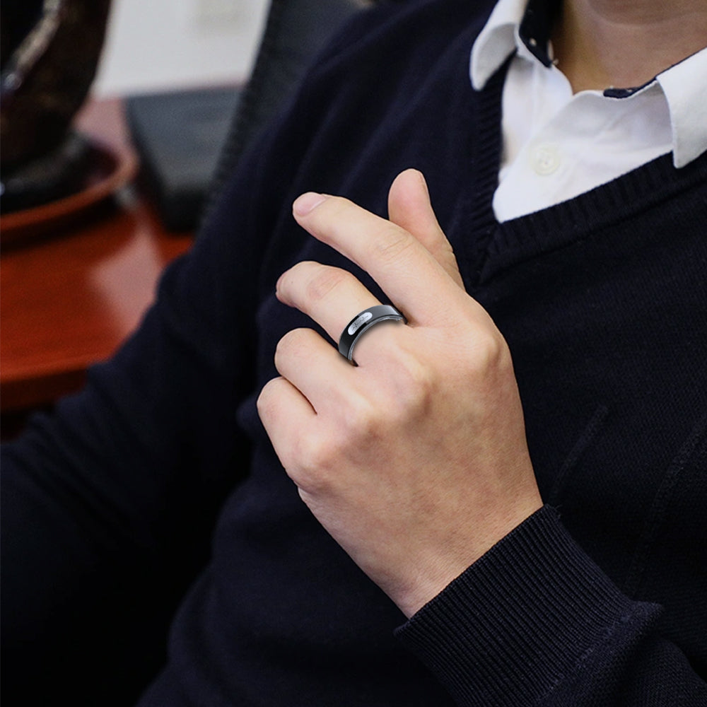 Black Kexi-Life R08 smart health ring on a man's finger, featuring ECG and blood pressure monitoring technology.
