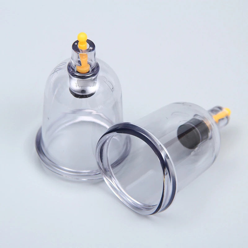 Two clear plastic Fitlybuy professional cupping therapy cups with yellow suction valves on a white background.