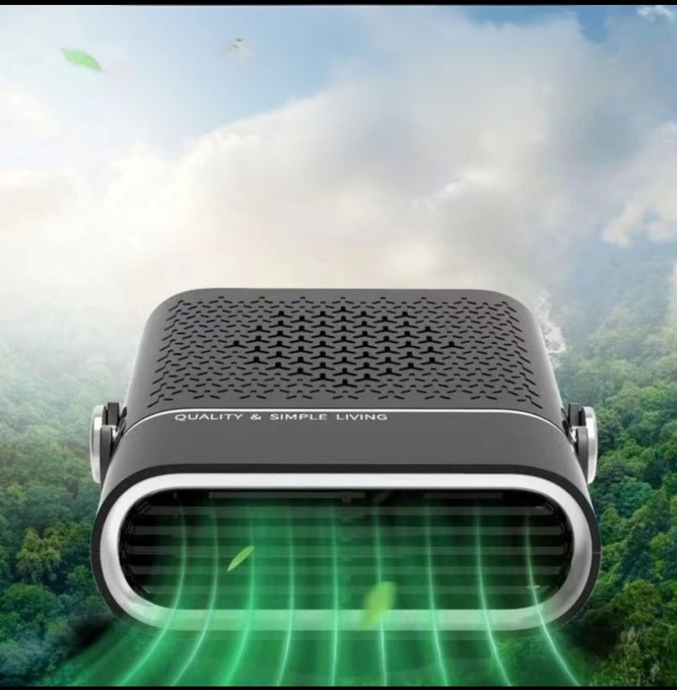 Black Fitlybuy AirComfy 4-in-1 car fan blowing green air against a scenic forest and sky background.