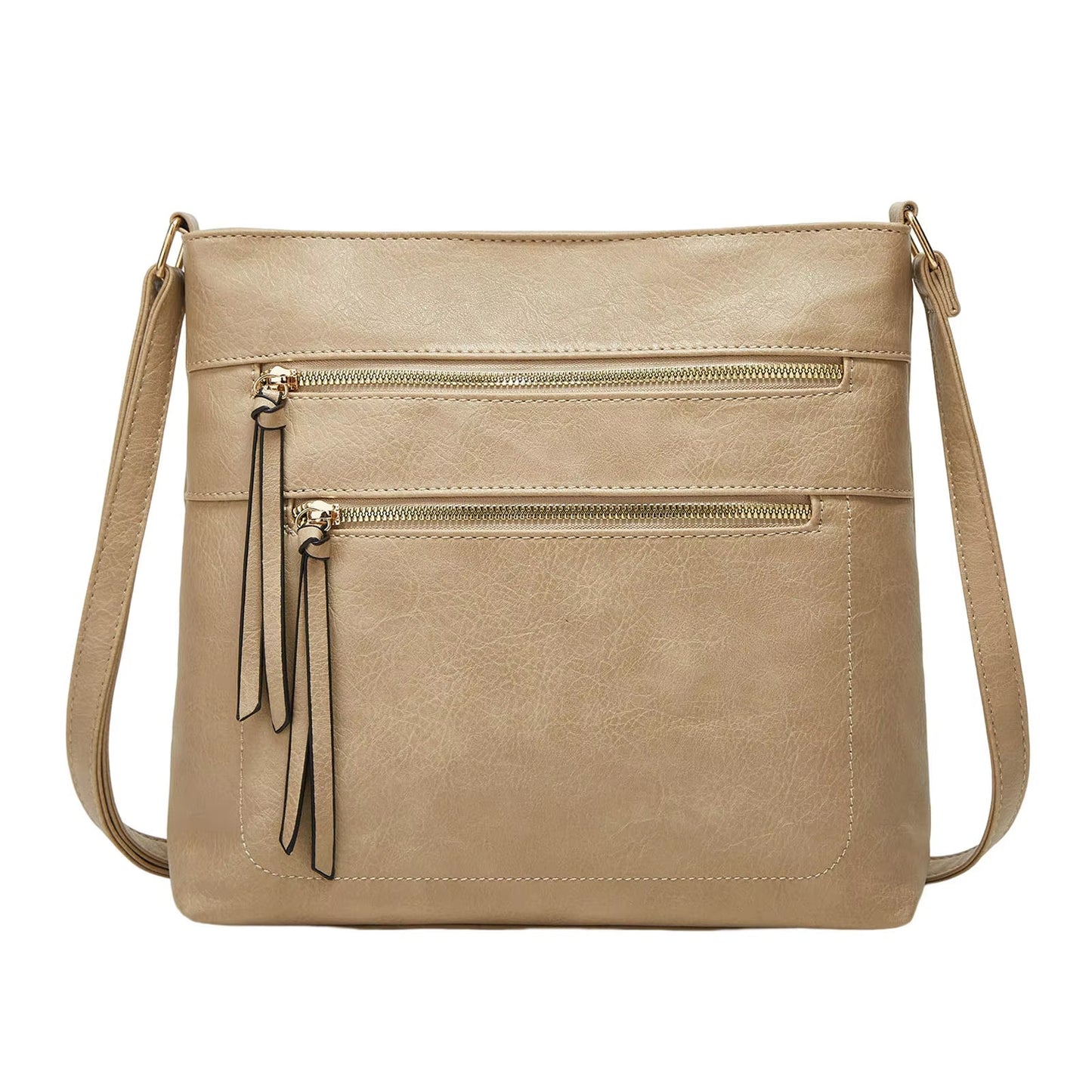 Fitlybuy Nina beige genuine leather crossbody bag with two front zippered pockets and matching tassel pullers.