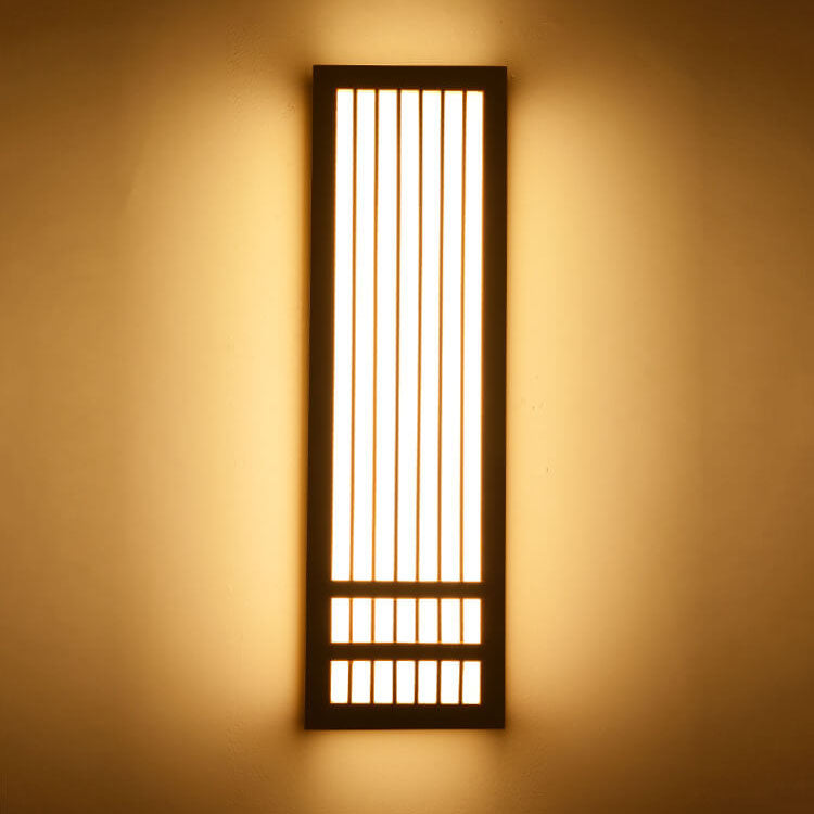 Rectangular Japanese wooden wall lamp with ZenGlow LED lighting emitting a warm, soft ambient glow on a neutral wall.