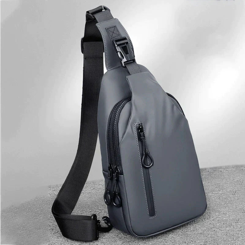 Gray waterproof Fitlybuy crossbody bag with SecureLock zipper pulls and adjustable black shoulder strap.