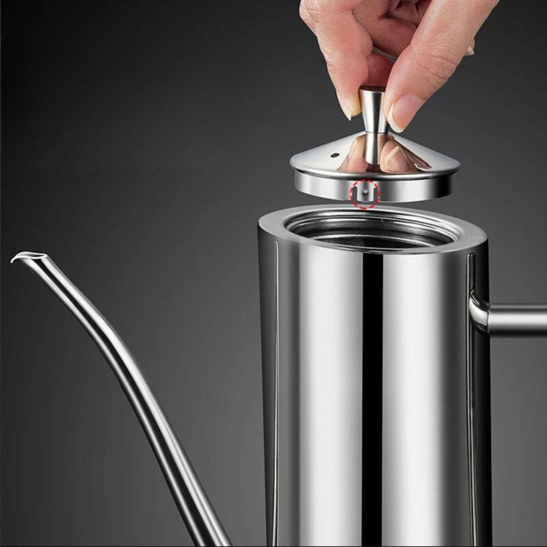 Hand lifting the lid off a sleek, cylindrical Fitlybuy stainless steel oil dispenser with a long, curved spout.