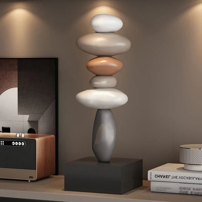 Fitlybuy Balanture Zen sculpture with stacked, multicolored pebble-like shapes on a black base, set in a modern home.