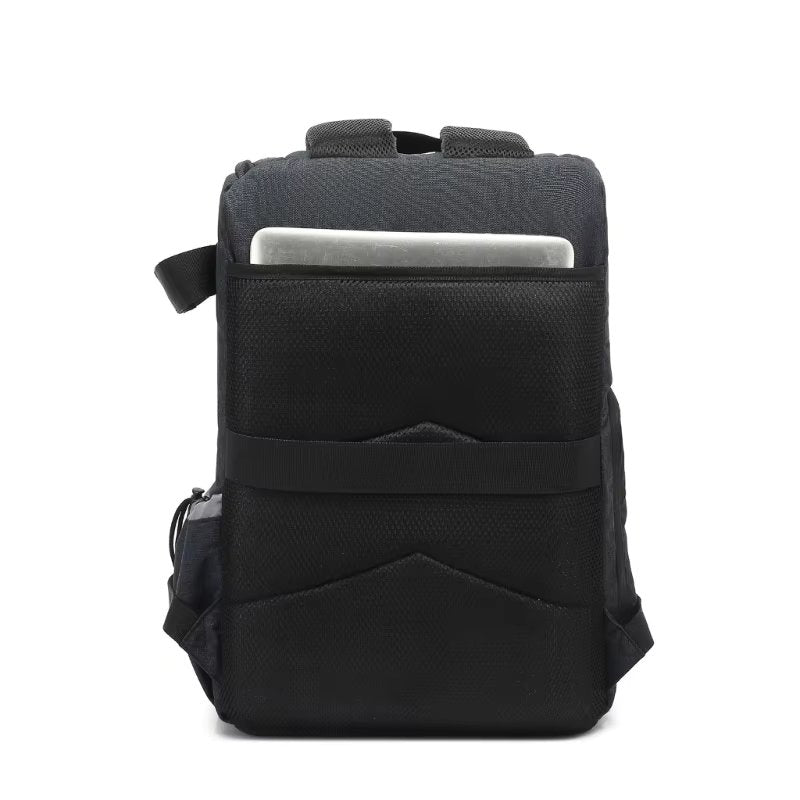 Fitlybuy Beckett waterproof black camera backpack rear view showing laptop compartment and padded mesh straps.