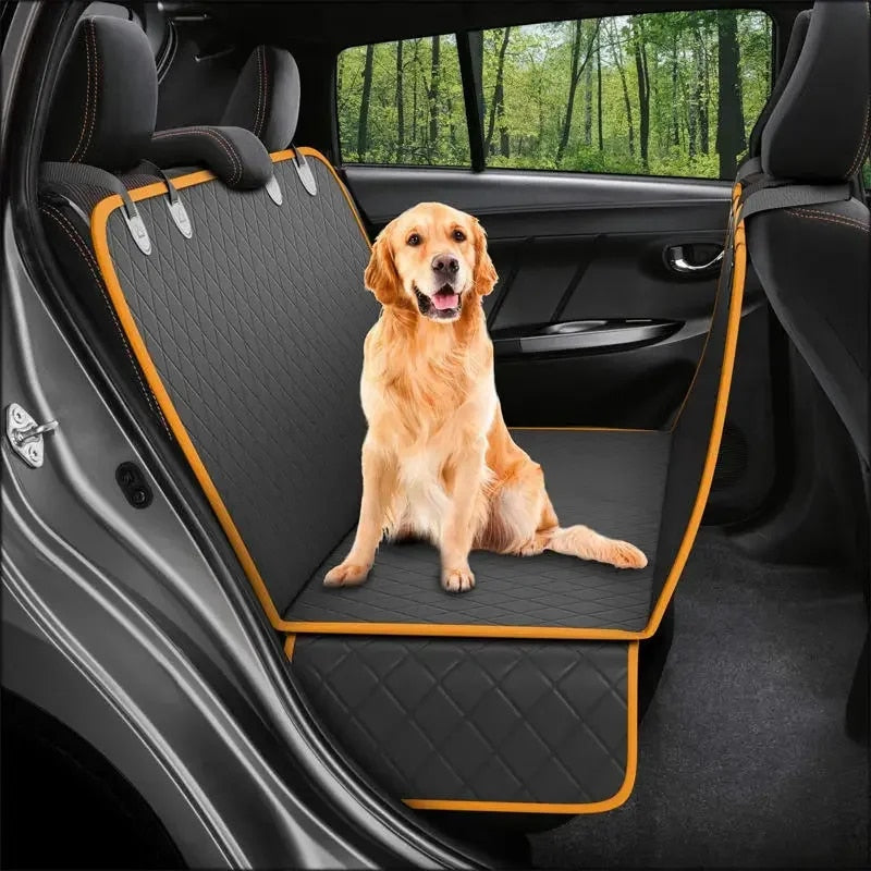 Golden retriever sits on a black quilted waterproof Fitlybuy dog seat protector with orange trim in a car backseat.