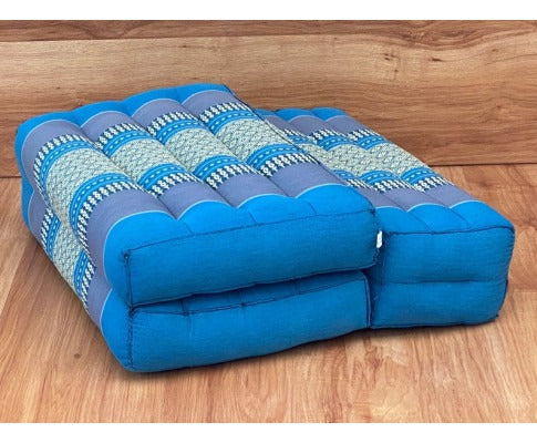 Fitlybuy 3-fold blue meditation cushion with ergonomic quilted design and patterned fabric on a wood background.