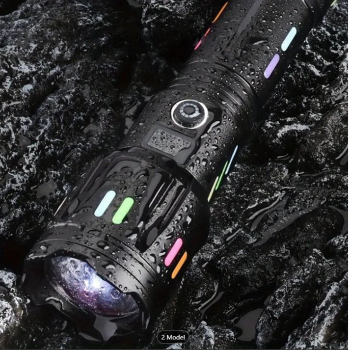 Fitlybuy TacticalPro 9000 black LED flashlight with colorful accent lights, covered in water droplets on dark rocks.