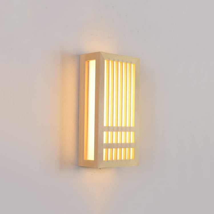 Rectangular Japanese wooden wall lamp with ZenGlow LED lighting emitting a warm, soft glow against a white wall.