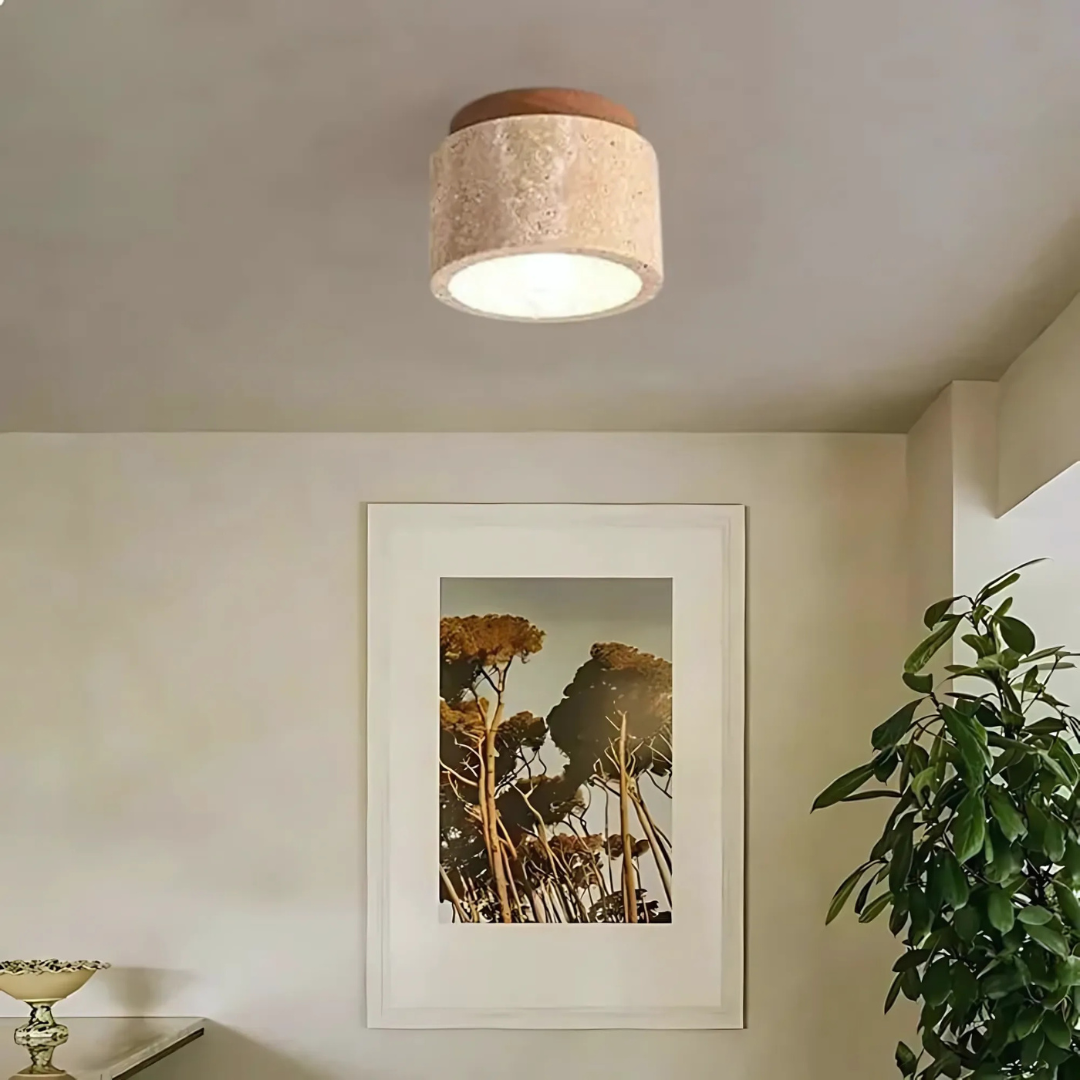 Fitlybuy Radia Japanese ceiling light with textured stone drum shade and warm glow in a minimalist room interior.