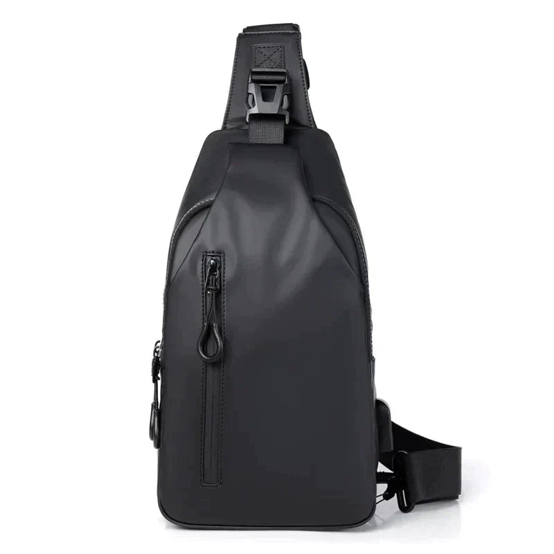 Fitlybuy black waterproof anti-theft crossbody bag with a vertical zippered pocket and secure buckle strap on white.
