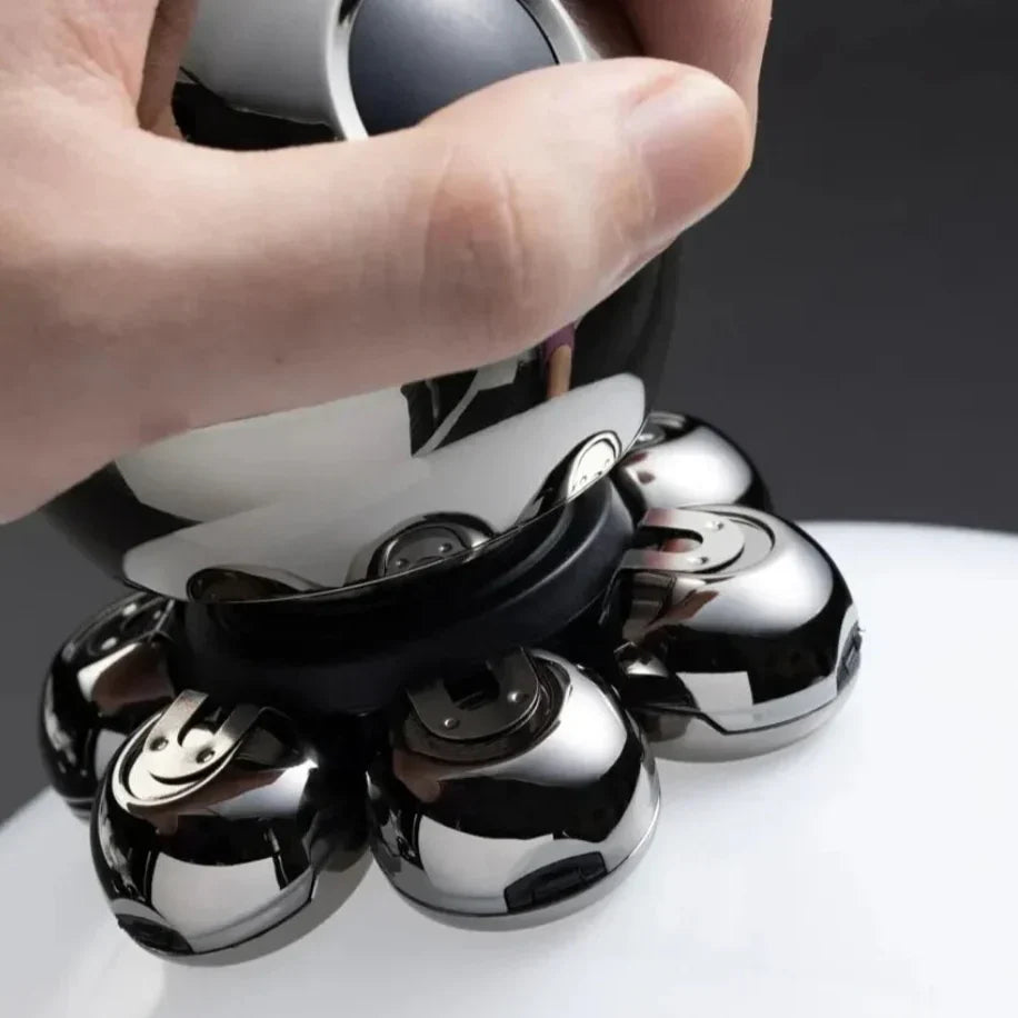 A hand holding a chrome Fitlybuy FlexiShave Pro 7D electric razor against a smooth white surface.