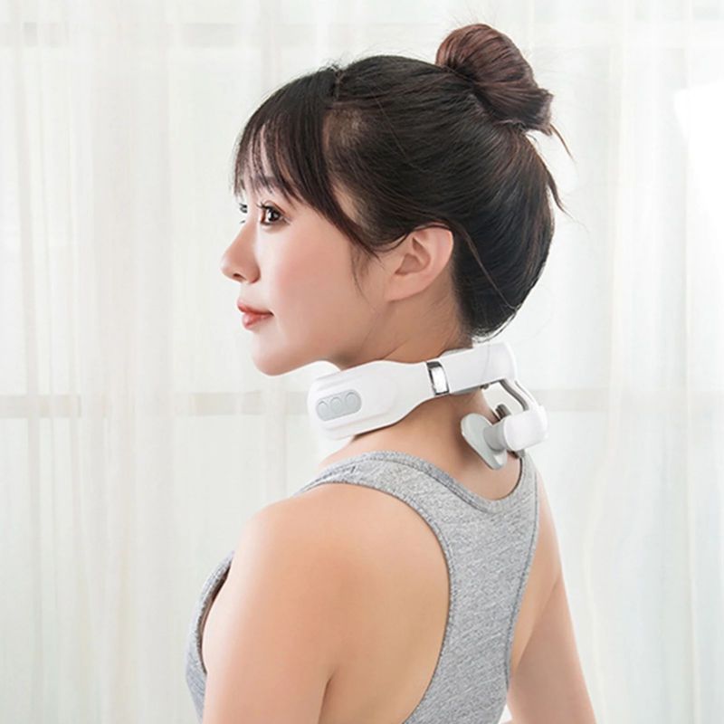 A woman wearing a white Fitlybuy 4-head cervical neck massager for soothing vibration relief.