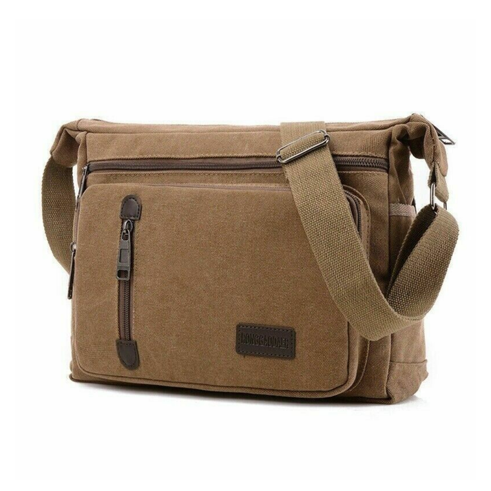 Brown canvas TravelPro shoulder bag with a spacious design, adjustable strap, and multiple secure zippered pockets.