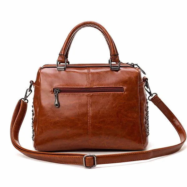 Fitlybuy brown soft leather shoulder bag with top handles, removable strap, and back zip pocket against white background.
