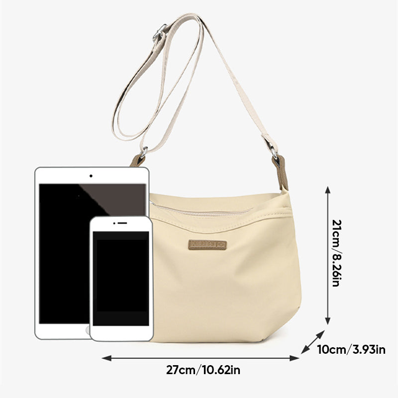 Beige Fitlybuy waterproof crossbody bag showing dimensions with tablet and phone for scale.