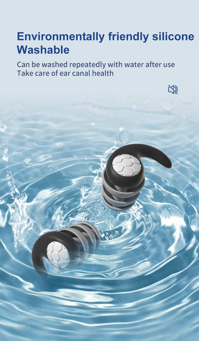 Fitlybuy washable, black and grey silicone noise-cancelling earplugs with foam tips submerged in clear water.