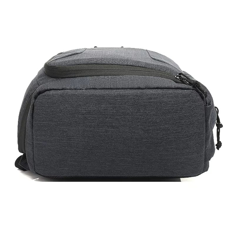 Grey Fitlybuy Beckett waterproof camera backpack with protective shell, black zippers, isolated on white background.
